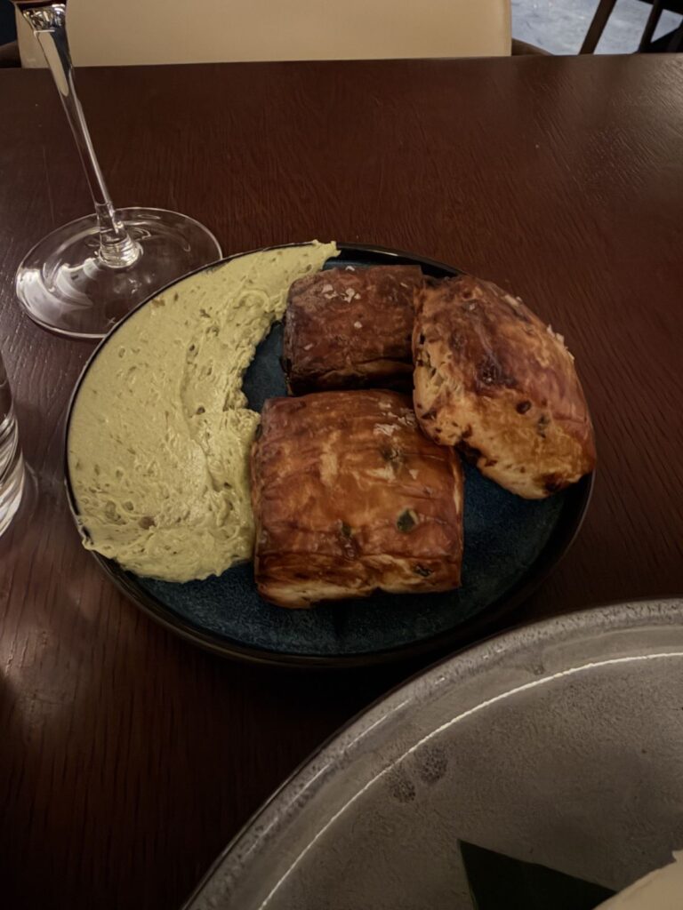 Poblano and pretzel biscuits with herb butter at Raya