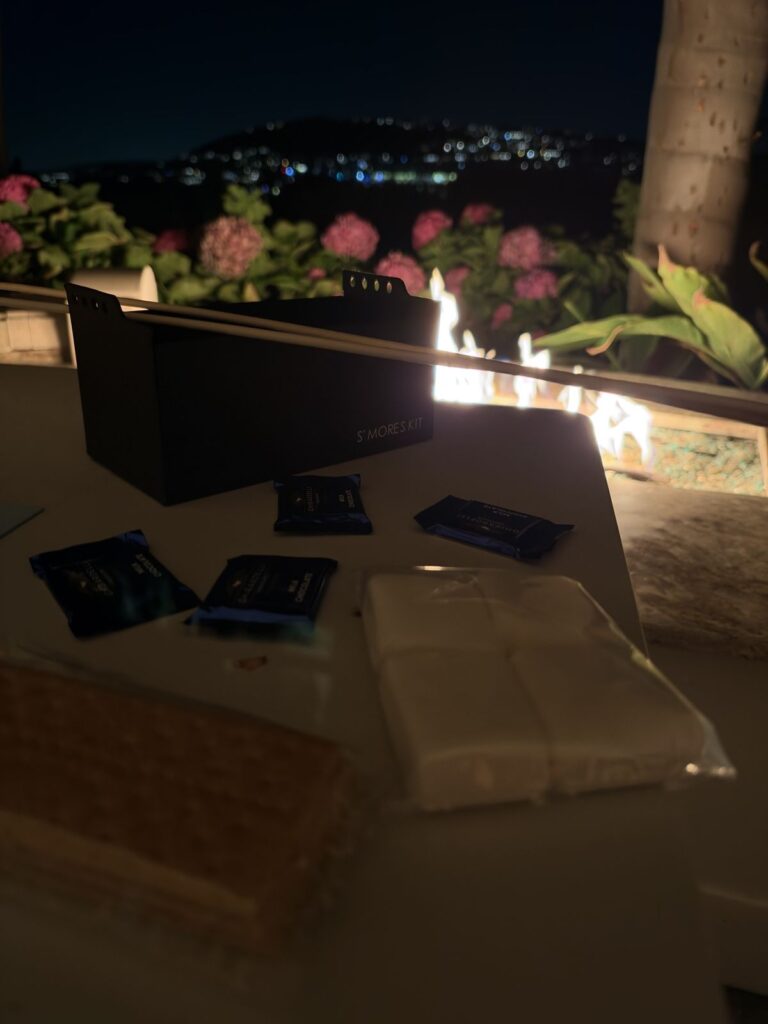 S'mores kit with Ghirardelli chocolate and marshmallows by the patio fire pit at night