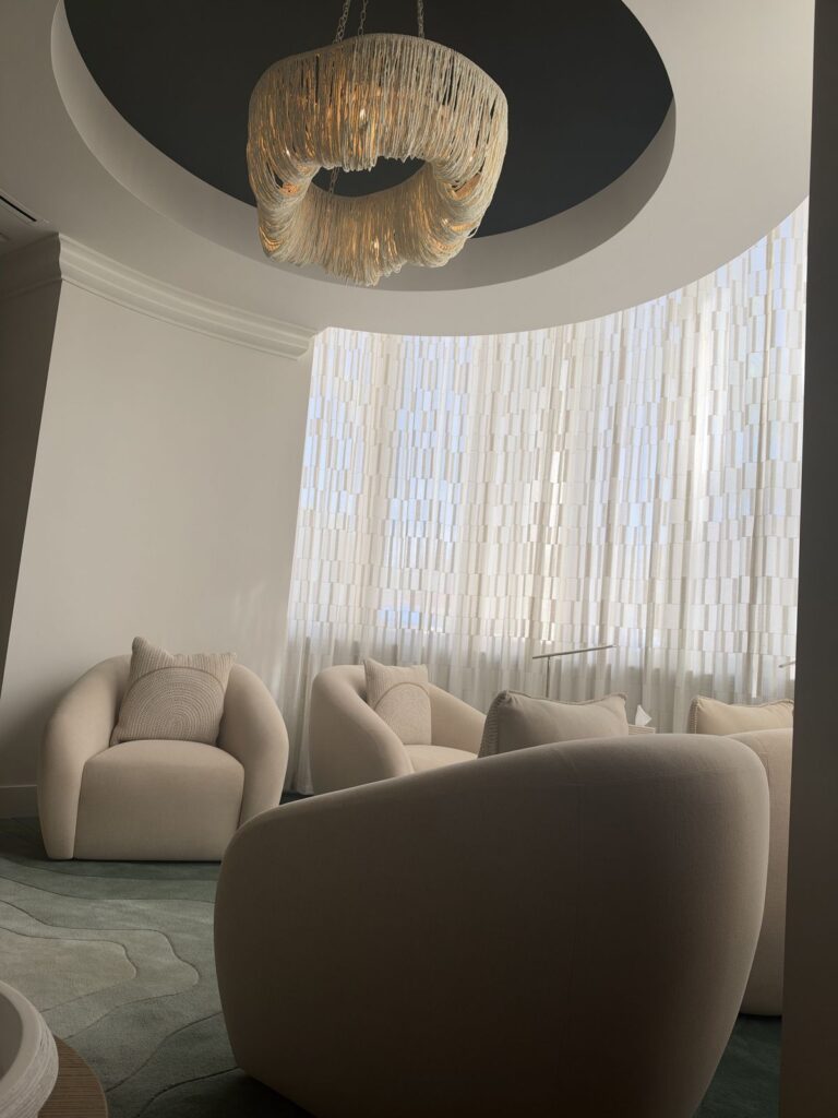 Relaxation lounge with curved sofas and chandelier at the Ritz-Carlton Laguna Niguel spa