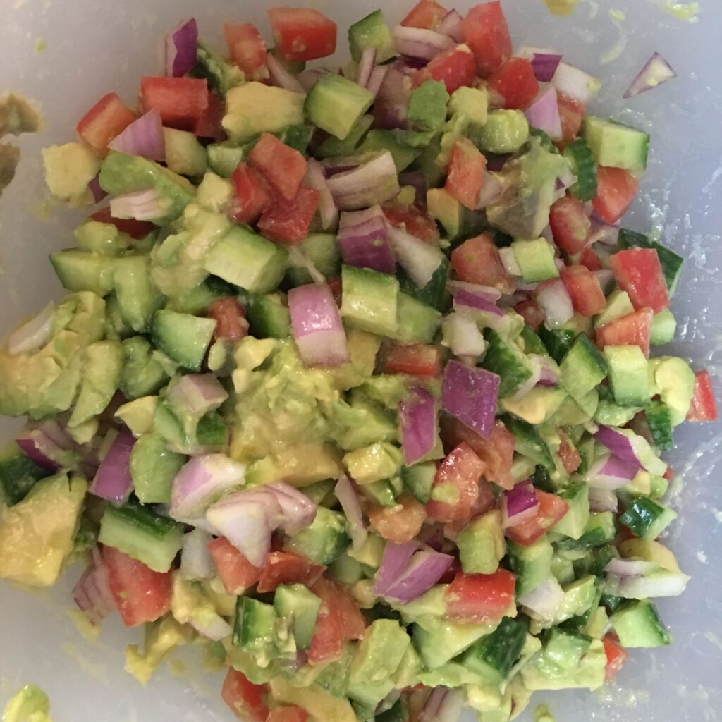 Chopped salad of cucumber, tomato, avocado, and red onion