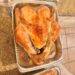 Roast turkey in a foil pan on the kitchen counter on Thanksgiving