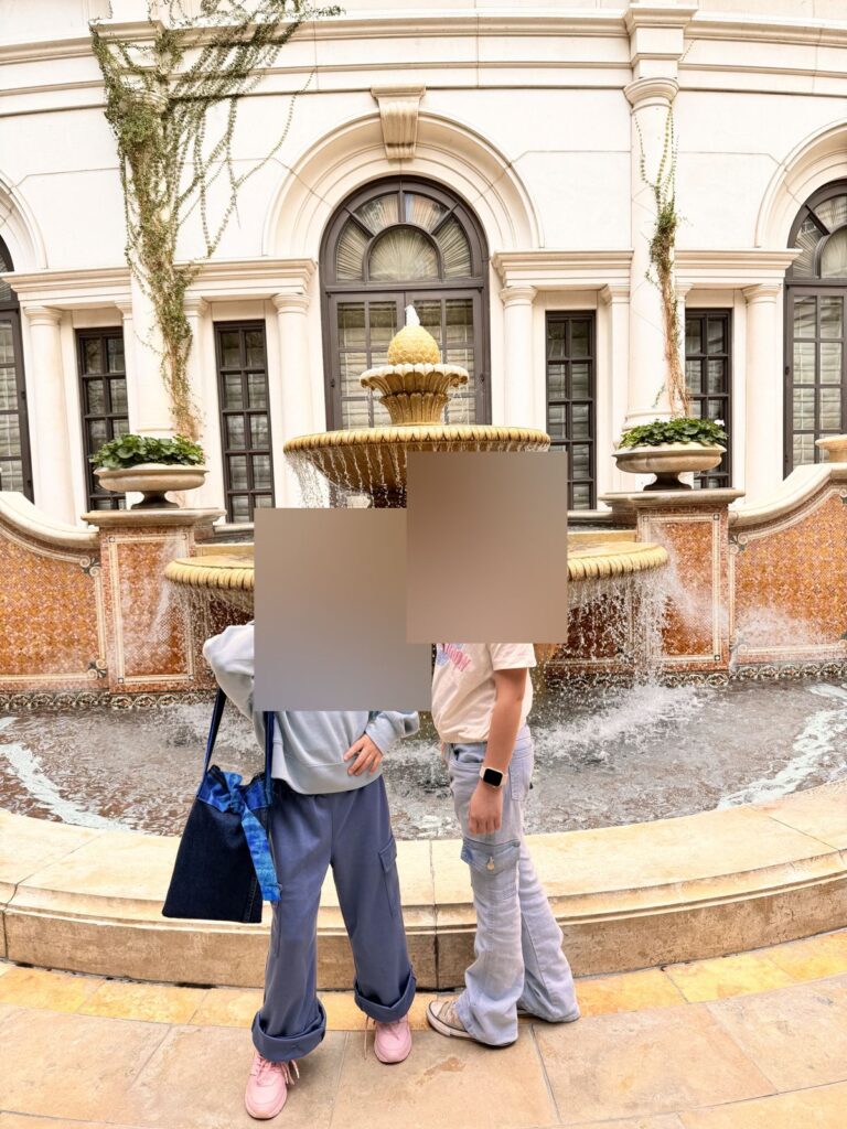 Two girls in front of a fountain at The Venetian
