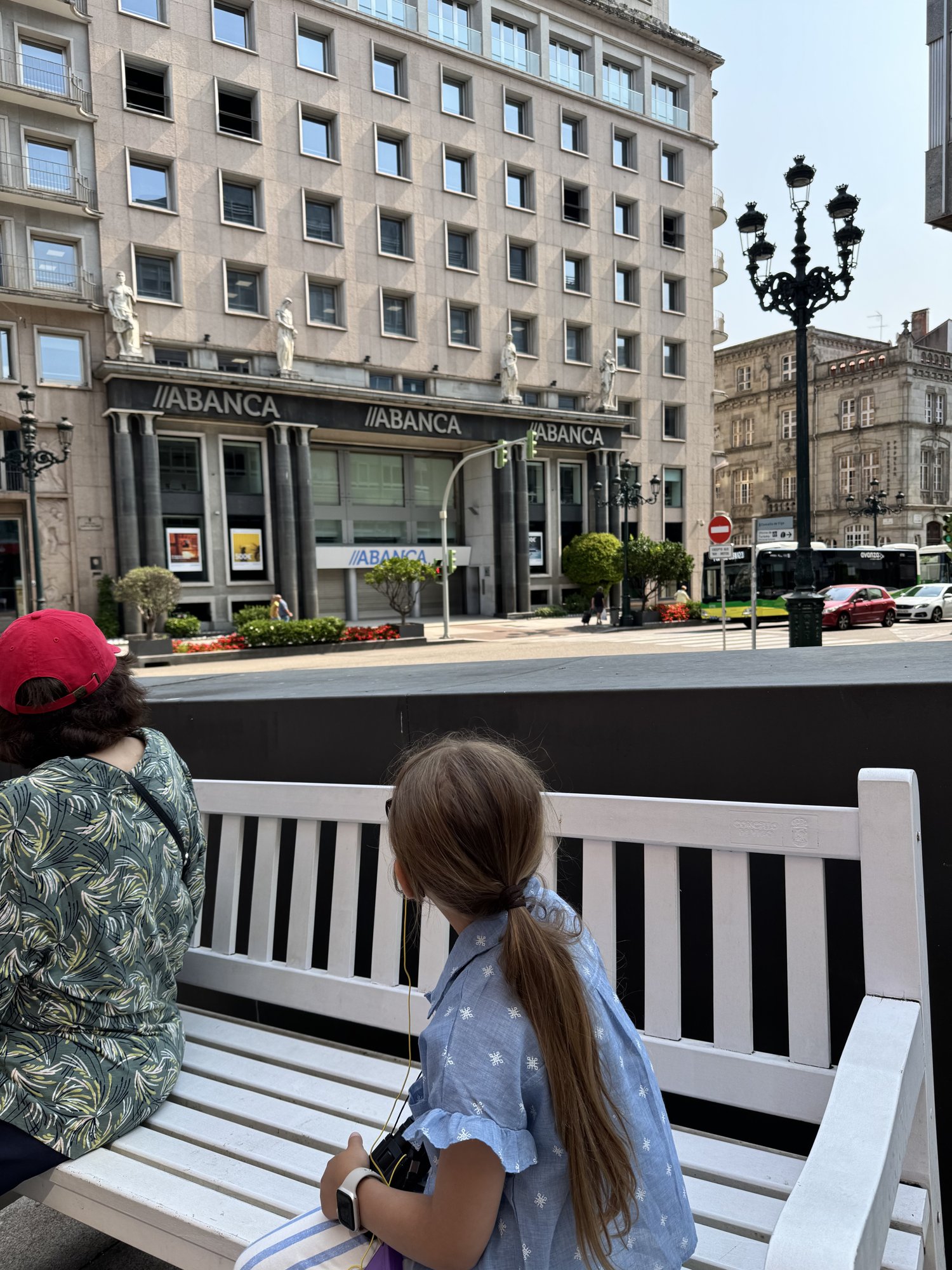Resting on a bench in downtown Vigo during a walking tour